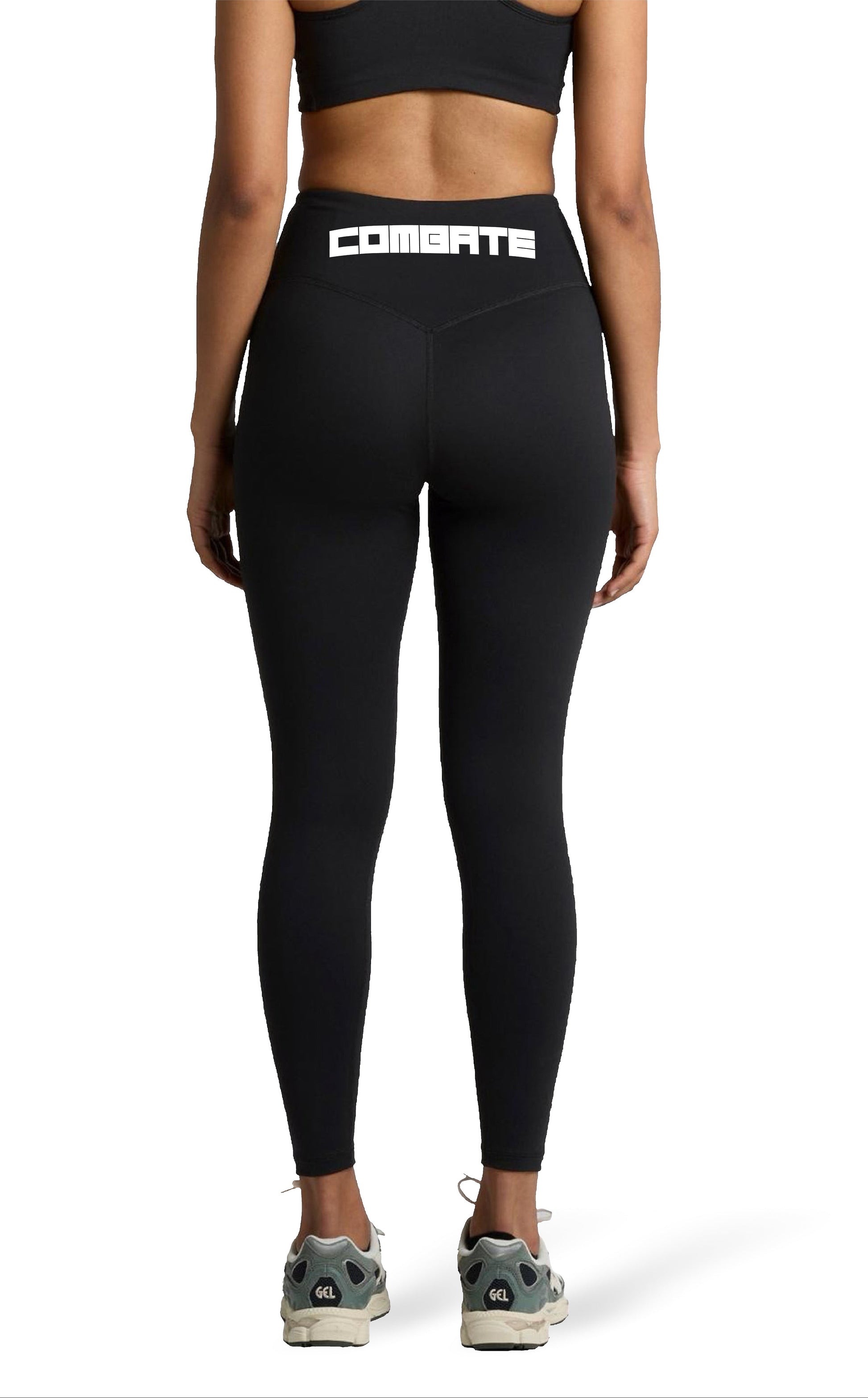 Person wearing black leggings with 'Combate' branding on a white background