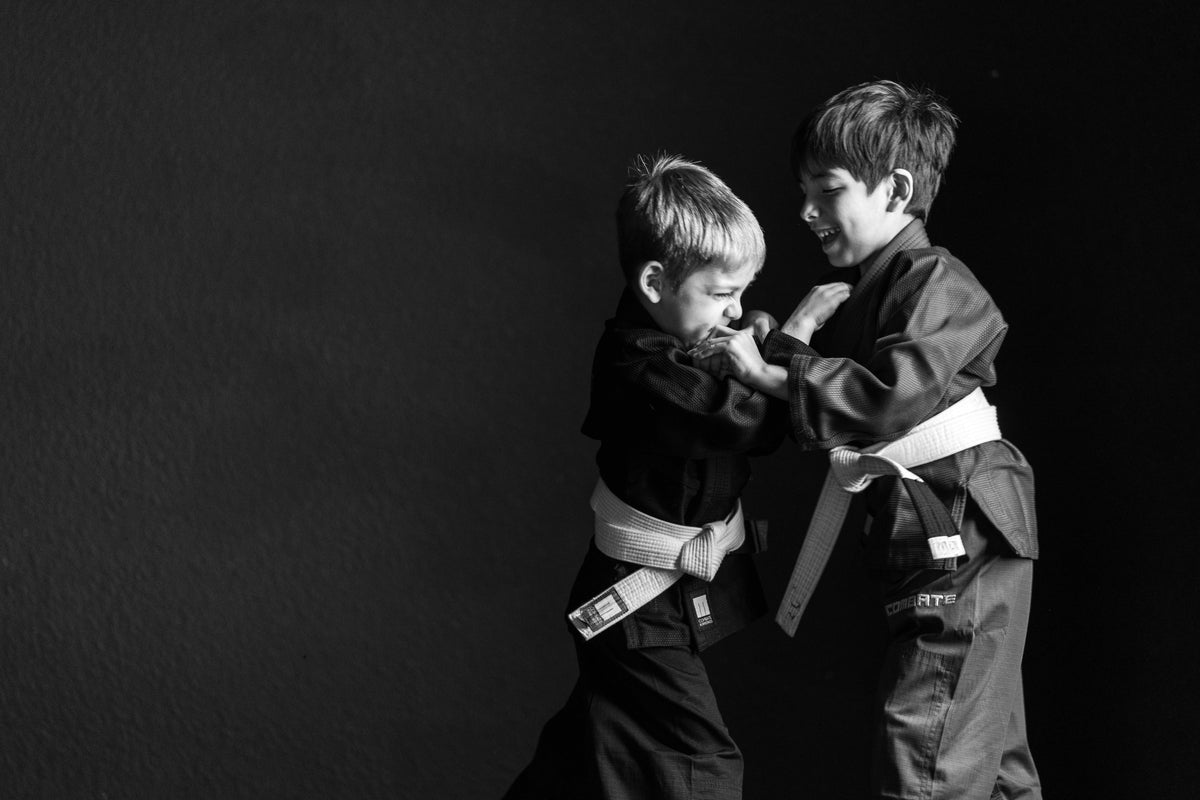 two kids grappling 