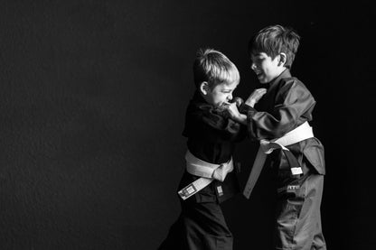two kids grappling 